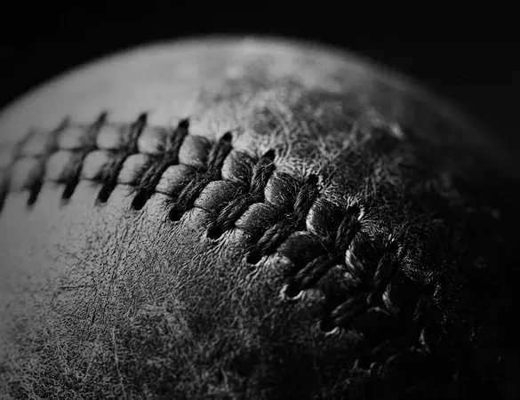 photo close up of a baseball in black and white
